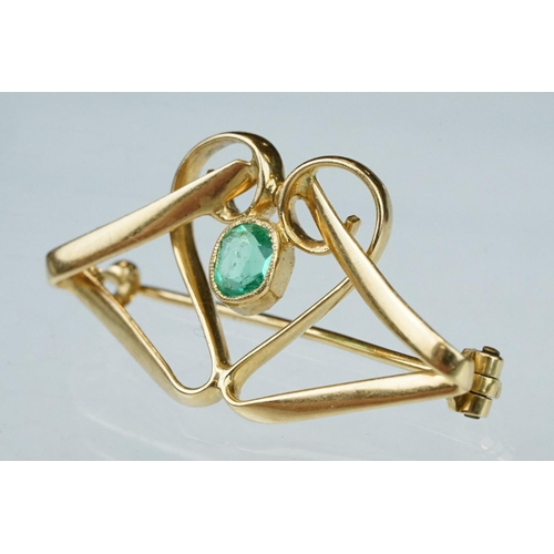 6 - Art Nouveau emerald unmarked yellow gold brooch, the central oval mixed cut emerald measuring approx... 