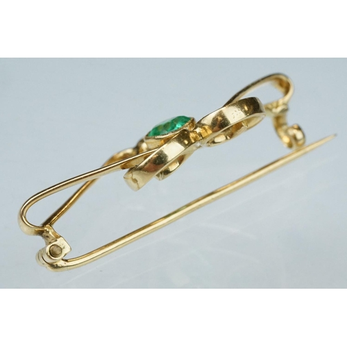 6 - Art Nouveau emerald unmarked yellow gold brooch, the central oval mixed cut emerald measuring approx... 