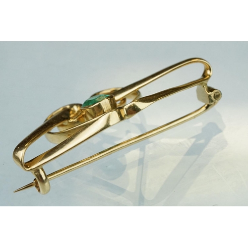 6 - Art Nouveau emerald unmarked yellow gold brooch, the central oval mixed cut emerald measuring approx... 