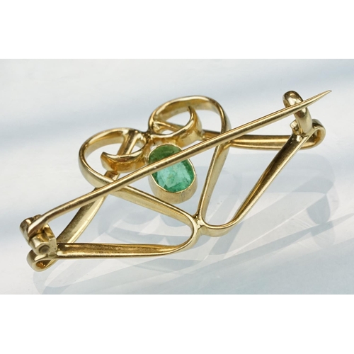 6 - Art Nouveau emerald unmarked yellow gold brooch, the central oval mixed cut emerald measuring approx... 