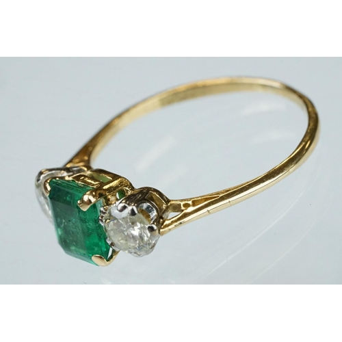 8 - Emerald and diamond 18ct yellow gold three stone ring,  the rectangular mixed cut emerald measuring ... 