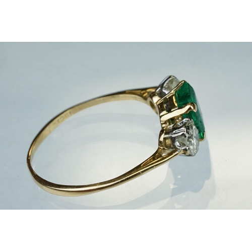 8 - Emerald and diamond 18ct yellow gold three stone ring,  the rectangular mixed cut emerald measuring ... 