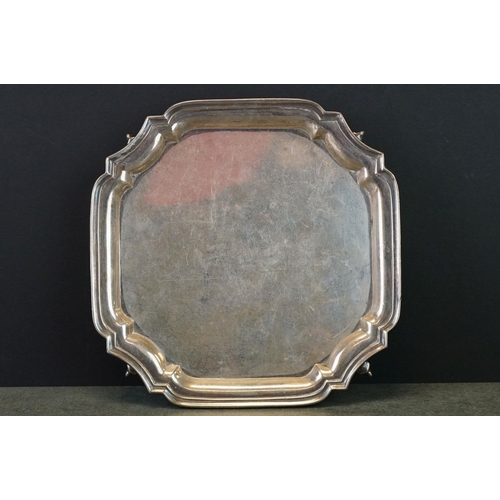 411 - Silver salver, octagonal form, plain polished, Chippendale border, raised on four scroll feet, maker... 