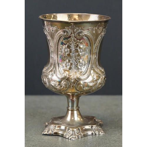 412 - Victorian silver chalice, repoussé and engraved floral and foliate scroll decoration, two blank cart... 