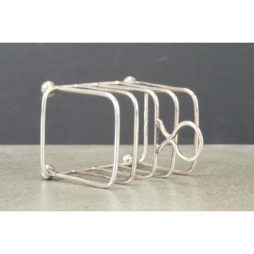 414 - Edwardian silver five bar toast rack, raised on four bun feet, makers TH Hazlewood & Co, Birmingham ... 