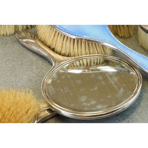 416 - Five piece enamelled silver dressing table brush set (enamel damaged), a silver backed oval clothes ... 