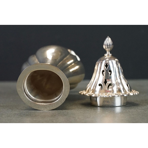 424 - Silver sugar caster, baluster form raised on scalloped oval foot, cast floral and foliate scroll bor... 