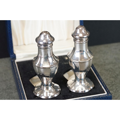 425 - Pair of silver cruets, baluster form raised on scalloped foot, makers S J Rose & Son, London 1970, h... 