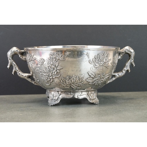 427 - White metal twin handled bowl raised on four feet, the handles modelled as branches, the bowl with c... 