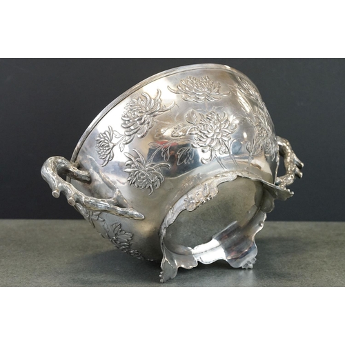 427 - White metal twin handled bowl raised on four feet, the handles modelled as branches, the bowl with c... 