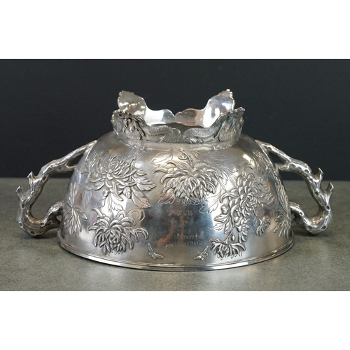 427 - White metal twin handled bowl raised on four feet, the handles modelled as branches, the bowl with c... 