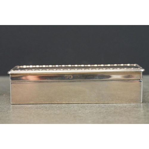 430 - Silver trinket box, repoussé border to the hinged lid, plain polished body, gilt interior, makers Le... 