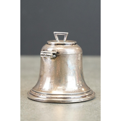 437 - Silver bell-shaped inkwell, weighted base, missing liner; together with a silver trinket dish, repou... 