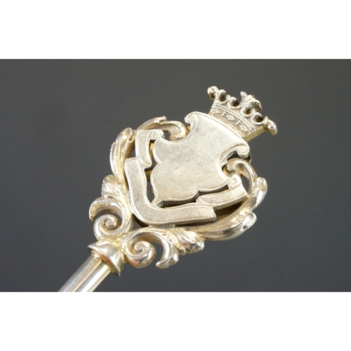 439 - Silver key in original case, blank cartouche, c with cast foliate scroll surround, crown surmount, m... 