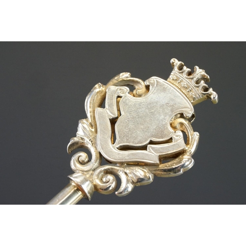 439 - Silver key in original case, blank cartouche, c with cast foliate scroll surround, crown surmount, m... 