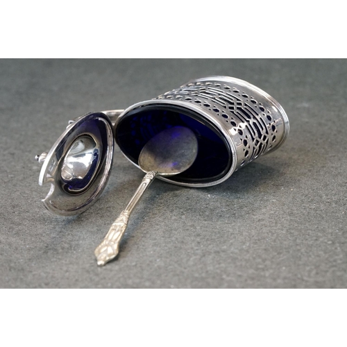 448 - Silver mustard pot and pepper pot, pierced form with geometric decoration, blue glass liners, makers... 