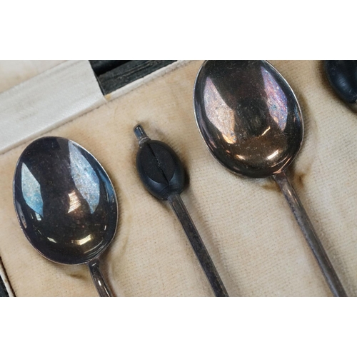 456 - Cased set of six Edwardian silver coffee spoons with matching sugar tongs, cast foliate decoration i... 