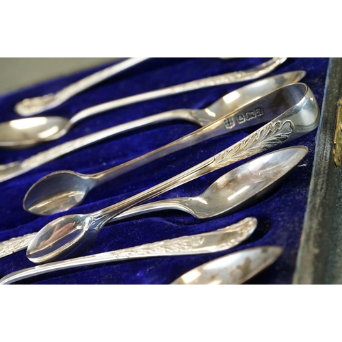 456 - Cased set of six Edwardian silver coffee spoons with matching sugar tongs, cast foliate decoration i... 