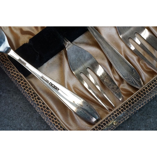 456 - Cased set of six Edwardian silver coffee spoons with matching sugar tongs, cast foliate decoration i... 