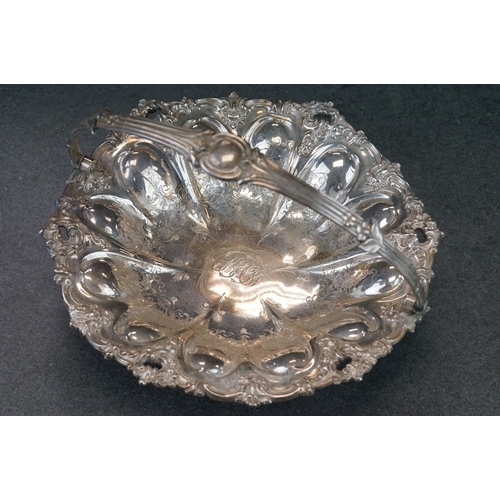 460 - Silver swing handled pedestal bowl, cast foliate scroll border, repoussé tapered panels with engrave... 