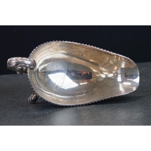 473 - Pair of silver sauce boats, gadroon border, scroll handle with cast acanthus leaf, three hoof feet w... 