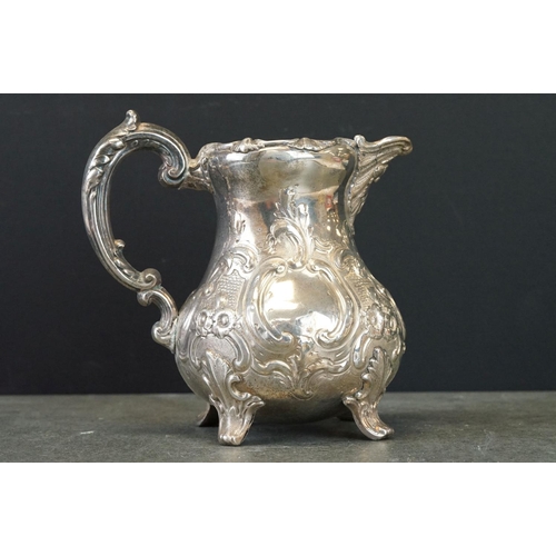 474 - Victorian silver jug, baluster form, stylised cast pie crust border, repoussé floral and foliate dec... 