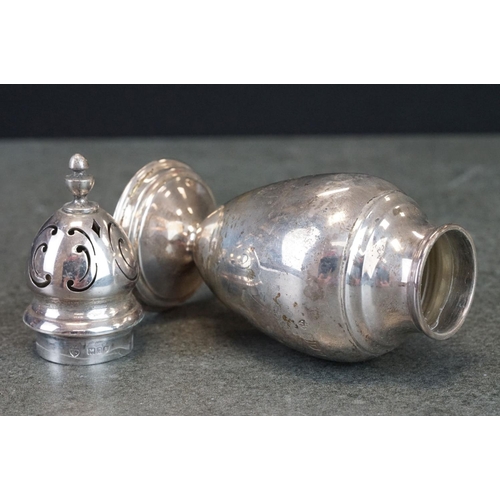 477 - Early George V silver sugar caster of baluster form, plain polished, moulder circular foot, makers E... 