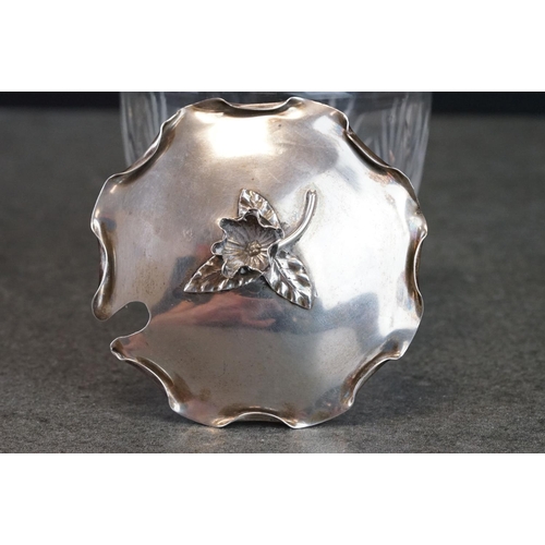 479 - Edwardian silver lidded cut glass preserve pot, the lid with scalloped folded border, cast flower he... 