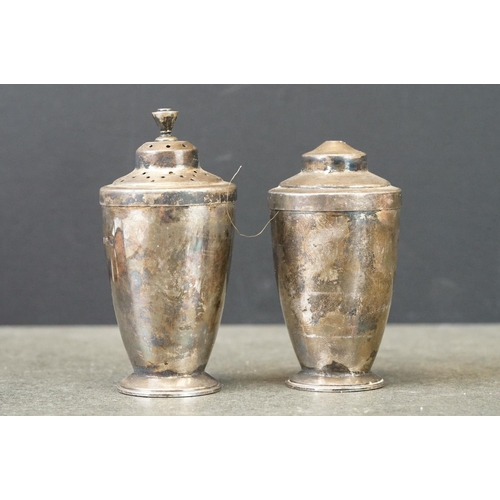 481 - Pair of silver salt and pepper pots, plain polished tapered form, circular foot, stepped lit with ta... 