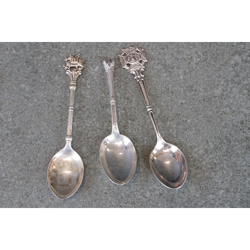 482 - Collection of silver souvenir teaspoons and pickle forks from around the world, to include paste and... 