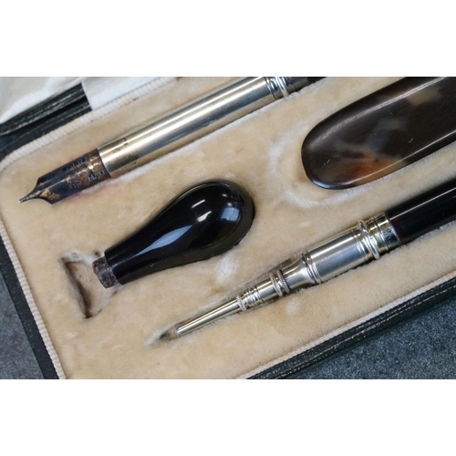 485 - Early 20th century tortoiseshell and silver stationary set, comprising dip pen, propelling pencil, l... 