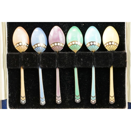 487 - Six harlequin enamelled silver demitasse spoons, the bowl reverse and terminal with silver inlaid de... 