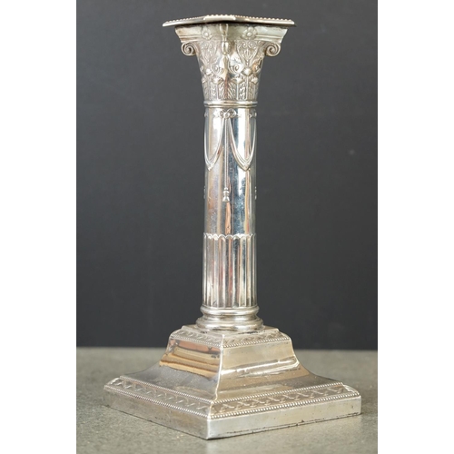 490 - Pair of Edwardian silver Corinthian column candlesticks, the sconce with cast floral and scroll deco... 