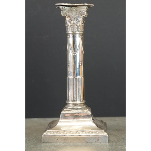 490 - Pair of Edwardian silver Corinthian column candlesticks, the sconce with cast floral and scroll deco... 