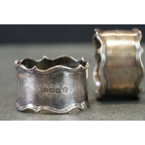 493 - Boxed set of two George V silver napkin rings with ribbed borders, engraved initials to front, Sheff... 