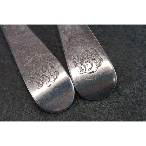 497 - Two George III Silver Old English Pattern serving spoons with monograms to handles, together with a ... 