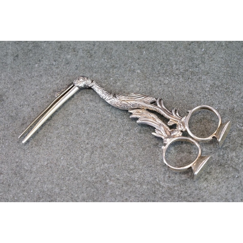 500 - Pair of Victorian silver ribbon puller stork scissors, with a serpent wrapped around its neck and be... 