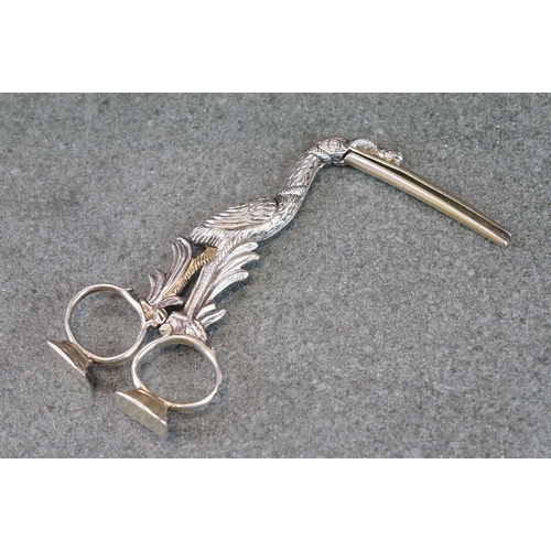 500 - Pair of Victorian silver ribbon puller stork scissors, with a serpent wrapped around its neck and be... 