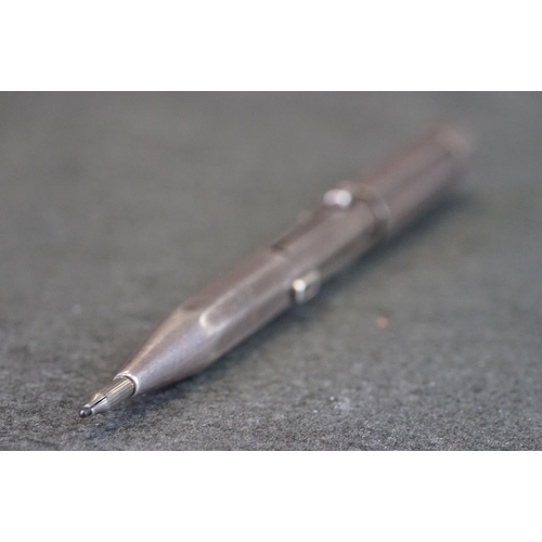 501 - Silver pencil with 4 retractable nibs and engine turned decoration, by JM & Co, London 1938, approx ... 