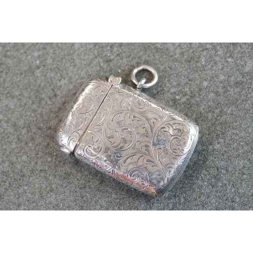 504 - Group of silver items to include three silver vesta cases, a silver propelling cuticle tool and a si... 