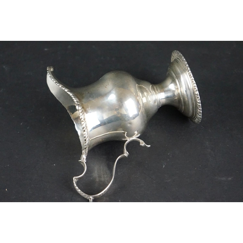 516 - Late Victorian silver tankard of tapered form, with engraved floral decoration, scrolling handle and... 