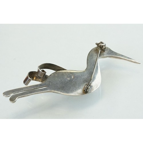 89 - Mexican silver brooch modelled as a flying stork, length approx 9cm; Mexican silver brooch modelled ... 