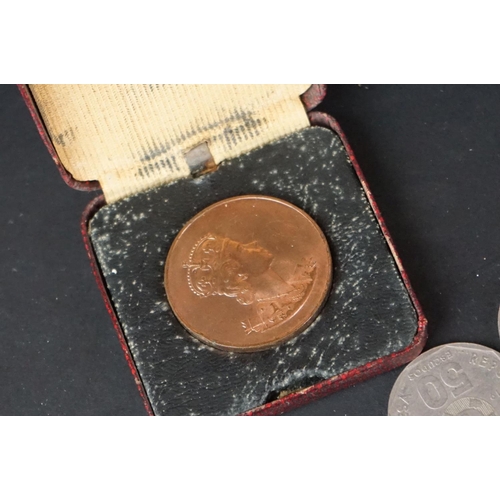 141 - A small collection of British and foreign coins together with a quantity of medallions.