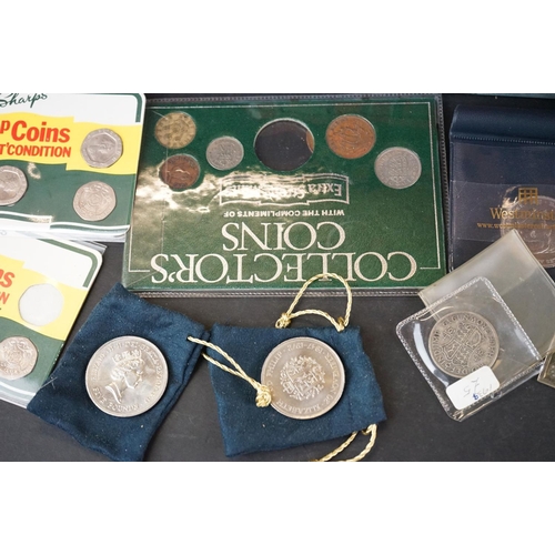 159 - A collection of coins to include silver proof £1 coin, year sets, commemorative crowns..etc.