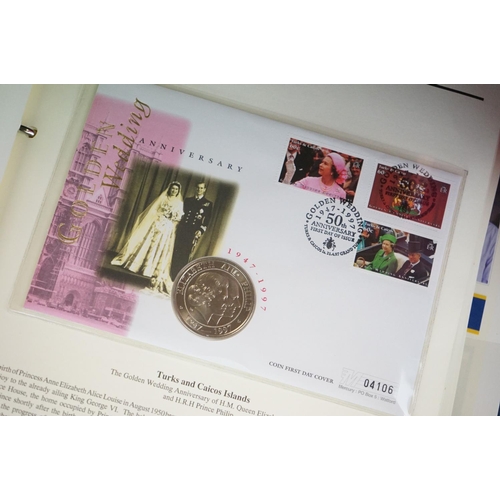 180 - A Westminster Mint 'The Royal Family' Coin & stamp cover collection contained within six albums.