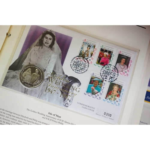 180 - A Westminster Mint 'The Royal Family' Coin & stamp cover collection contained within six albums.