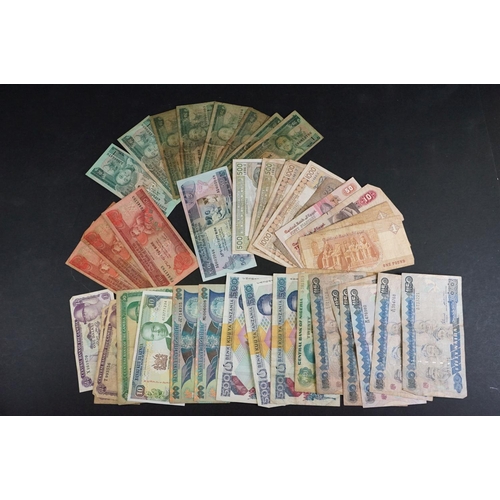 58 - A collection of approx forty banknotes, mainly from African nations.