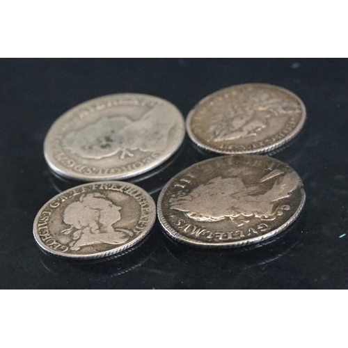 14 - A collection of four British pre decimal early milled silver coins to include King George II and Kin... 