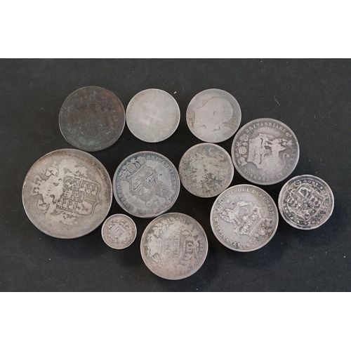 27 - A small collection of early milled British pre decimal silver coins to include George III examples.