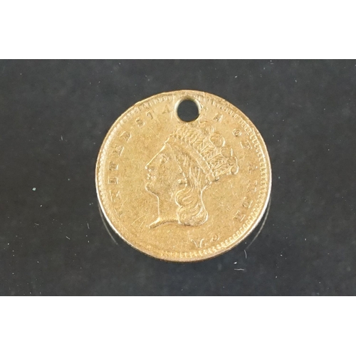 7 - A United States of America solid gold $1 dollar coin.